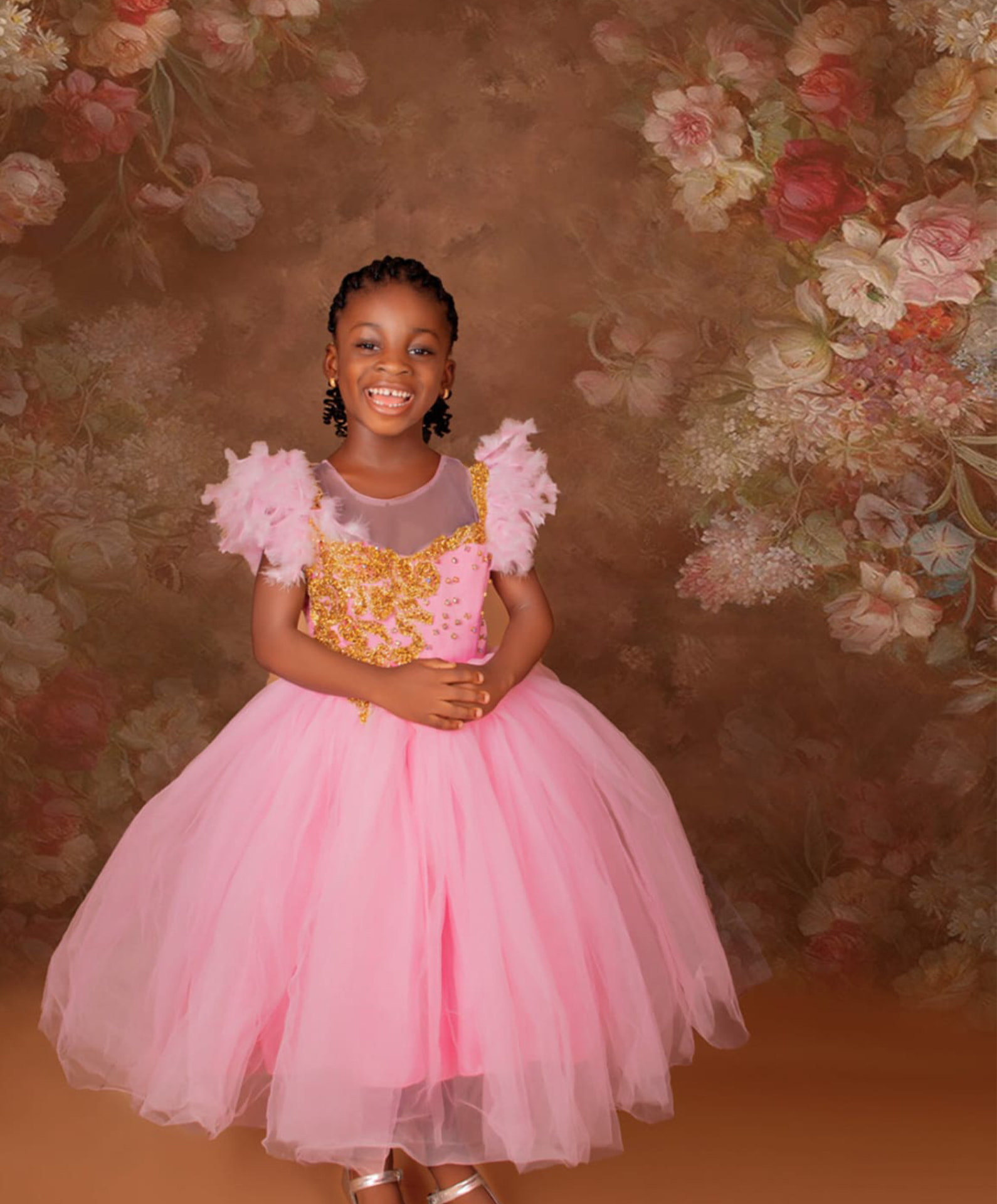 Smiling girl in a pink dress